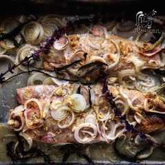Una foto de Corvina al horno con ghee, salvia y limón