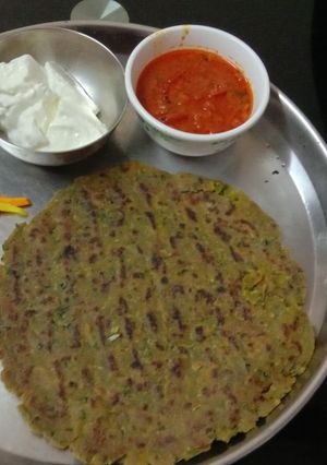 A picture of Bajra atta Dhebra with fresh fenugreek and green garlic.