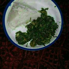 A picture of Ugali, beef, kales,and managu.