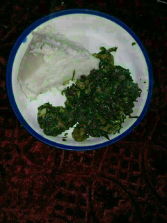 A picture of Ugali, beef, kales,and managu.