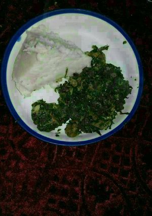 A picture of Ugali, beef, kales,and managu.