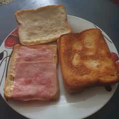 A picture of Pan fried Cheese and Ham Toasties.