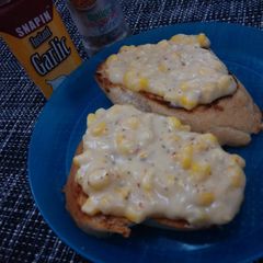 A picture of Garlic Toast with Creamy Corn Topping.