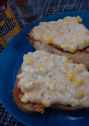 A picture of Garlic Toast with Creamy Corn Topping.