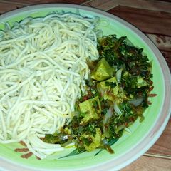 Spaghetti with green vegetable and egg moi moi A picture of Spaghetti with green vegetable and egg moi moi.
