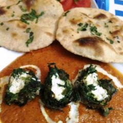 A picture of Palak Paneer Kofta with Tandoori Roti.
