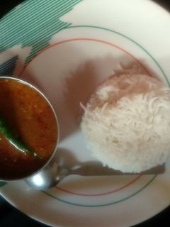 A picture of Dal tadka with steamed rice.