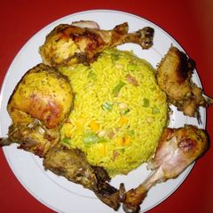 A picture of Fried rice with grilled chicken.
