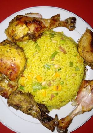 A picture of Fried rice with grilled chicken.