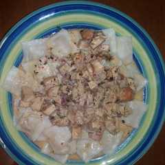 Una foto de Ravioles con crema y pollo
