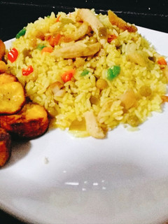 A picture of Fried rice with shredded Chicken.