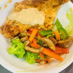 A picture of Grilled Chicken Breast with Sautéed Veggies.