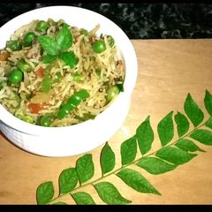 A picture of Dum Mix veg Biryani in curry Leaves.