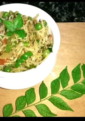 A picture of Dum Mix veg Biryani in curry Leaves.