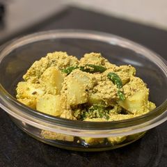 A picture of Aloo Posto (Potatoes cooked with poppy seed paste).