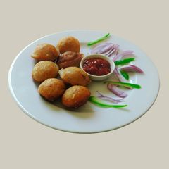 A picture of Spicy appam stuffed with masala potato.