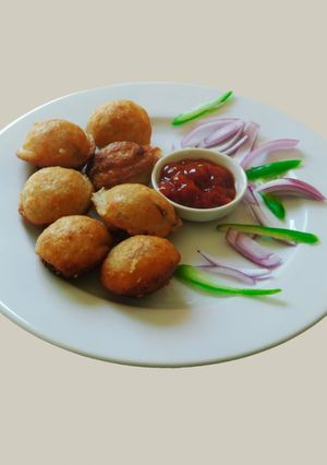 A picture of Spicy appam stuffed with masala potato.