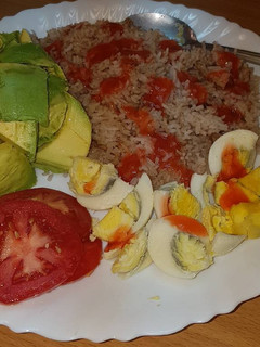 A picture of Boiled eggs served with rice.