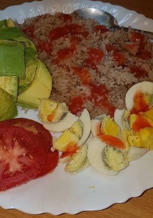 A picture of Boiled eggs served with rice.