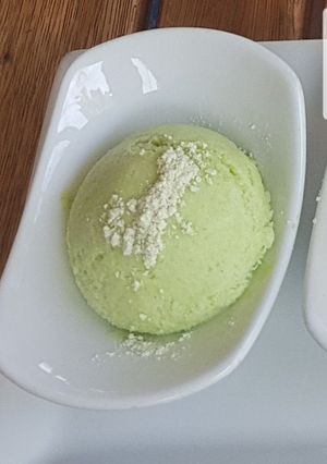 A picture of Summer pea and wasabi ice cream.