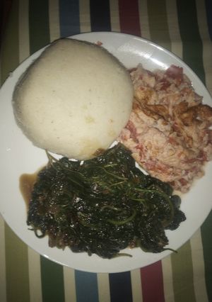 A picture of Ugali, fried amarantha and eggs.