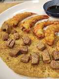 Gamba roja con harina de garbanzo y cous cous de mango con dados de solomillo de ternera lechal