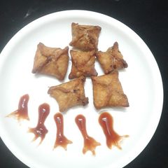 A picture of Lilva beans stuffed flower samosa.