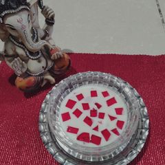 A picture of Shrikhand with strawberry flavour jelly.