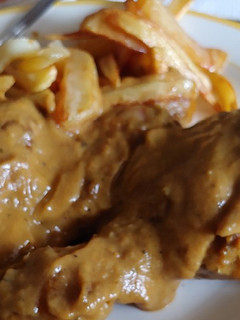 Una foto de Jamoncitos de pollo a la naranja, clavo y apio