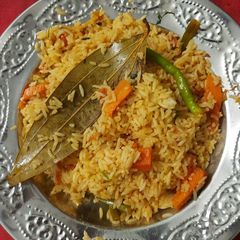 A picture of Veg Biryani with leftover rice.