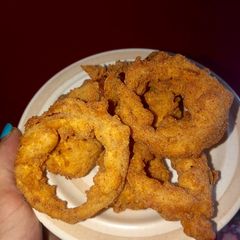 A picture of The perfect onion rings.