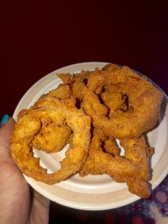 A picture of The perfect onion rings.