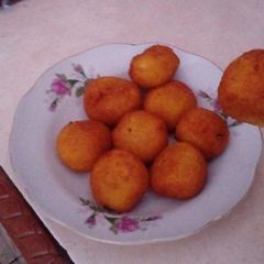 Grated Cassava Ball with Palm Sugar (Jemblem) A picture of Grated Cassava Ball with Palm Sugar (Jemblem).