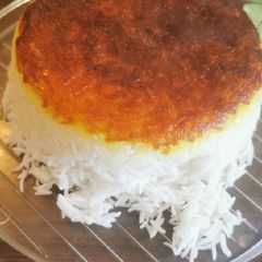 A picture of Persian rice with crispy grated potato TAHDIG.