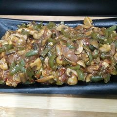 A picture of Schezwan mushroom fry.