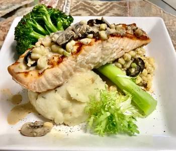 Easy Recipe Grilled salmon Topped with a mushroom Black olives White corn cream sauce Garlic Mashed potatoes Delicious Perfect