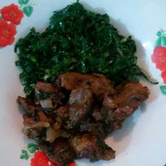 A picture of Beef fried with sukuma wiki.