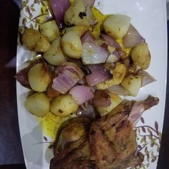A picture of Potato lyonnaise with grilled chicken.