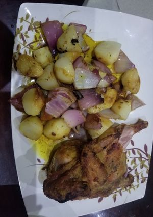 A picture of Potato lyonnaise with grilled chicken.