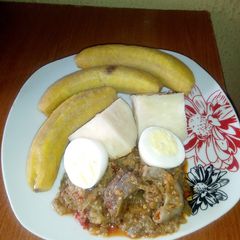 A picture of Garden egg sauce,unripe plantain and yam.