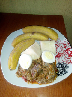 A picture of Garden egg sauce,unripe plantain and yam.
