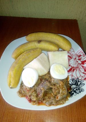 A picture of Garden egg sauce,unripe plantain and yam.