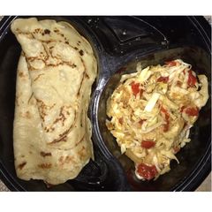 A picture of Crepes and cabbage sauce.