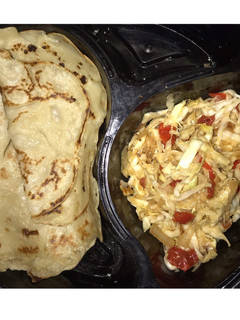 A picture of Crepes and cabbage sauce.