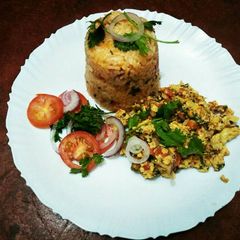 A picture of Fried rice with scrambled eggs.