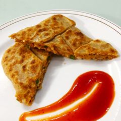 A picture of Pizza pocket parantha.