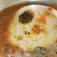 A picture of Idly with rasam.