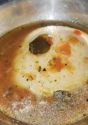 A picture of Idly with rasam.