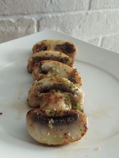 Una foto de Txanpis al aceite de brócoli y zanahoria
