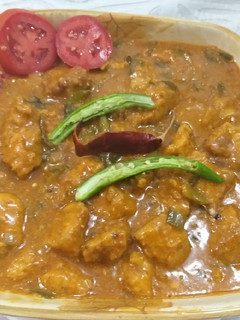 A picture of Chicken 65 with gravy.